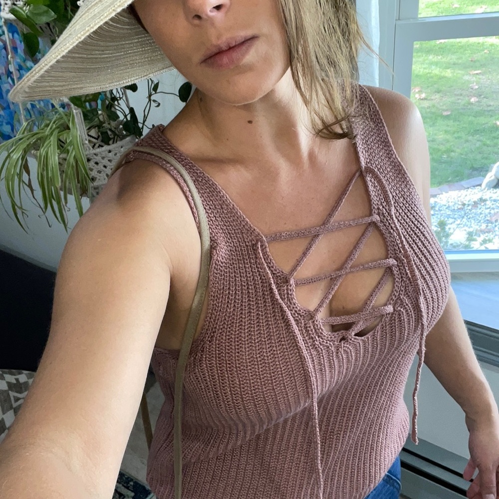 Sweater tank top with lace up chest detail in a mauve color!